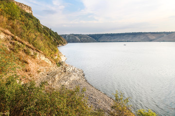 landscape view of the big lake. sandy beach, forest