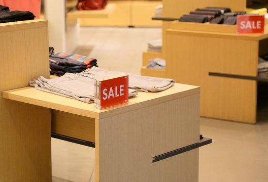 sale sign on clothing shop