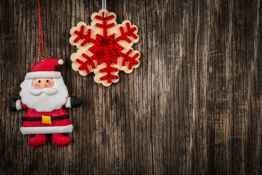 Santa andsnowflake over vintage wood