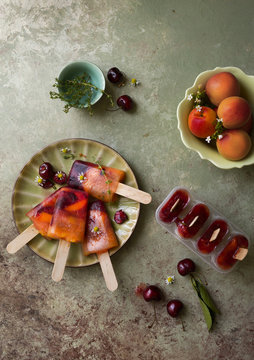 Ice pops made from apricot and cherry, overhead view