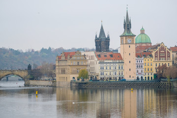 Prague,  Czechia - November, 24, 2016: Panorama of an old Prague, bridges and embankment of Vitava river, Czechia