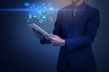 Close up of businessman playing multimedia with social media ico