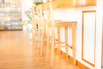 Interior stool chair with vintage bar in light flare. Soft focus over lighting with flares lights.