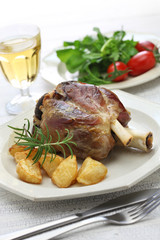 pork shank with roasted potatoes, italian cuisine, stinco di maiale con patate arrosto