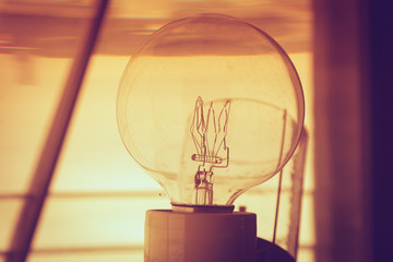 inside of a lighthouse showing the light bulb interior.
