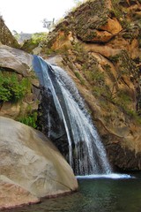 Long shot of a waterfall on the Cascadas del rio Colorado Trek close to Cafayate in Argentina, South America © mandy2110