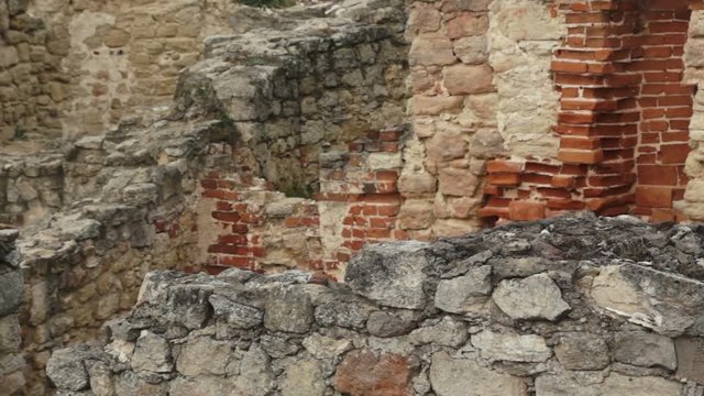 camera slide over walls of ruins of medieval castle in city of ilza in poland