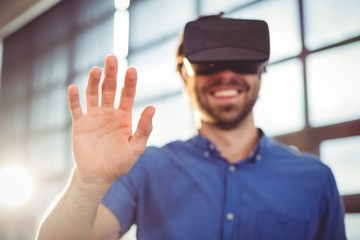 Male business executive using virtual reality headset