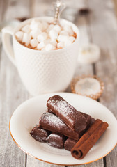 Chocolate dessert and mug of cacao