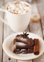 Chocolate dessert and mug of cacao