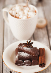 Chocolate dessert and mug of cacao