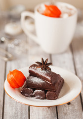 Chocolate dessert and mug of cacao