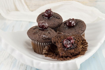 Dark chocolate muffins in paper cups