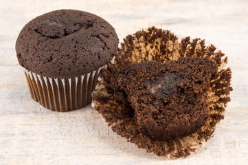 Dark chocolate muffins in paper cups