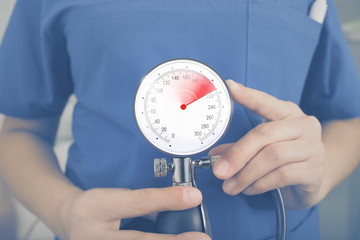 Medical concept with doctor holding manometer