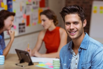 Business executive smiling with colleagues 