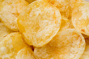 Close up potato chips on wood top view background.