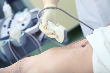 Ultrasound exam of patient carrying out by female doctor