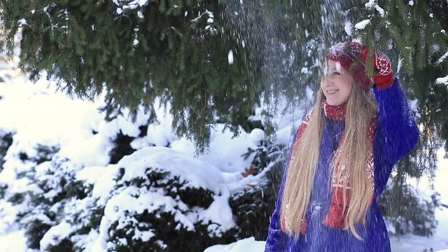 Happy girl getting a snow shower
