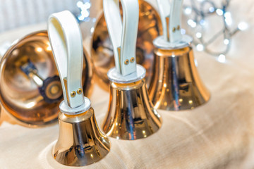 Set of gold handbells on table during concert