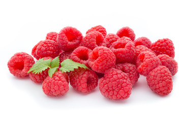 Ripe raspberry with leaf isolated on the white background.