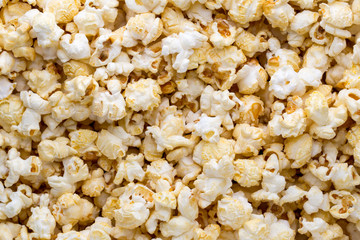 Popcorn background. Caramel sweet corn. Cinema snack.