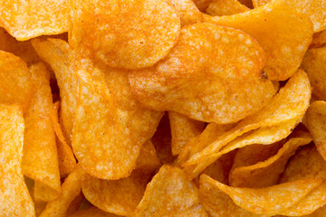 Fototapeta premium Potato chips on the papric. Eco food.