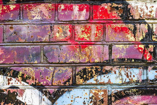 Brick wall with grafitti. Colorful painted close up