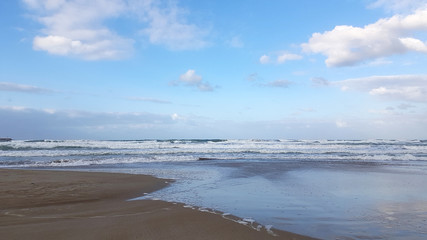 Deserted beach near the blue sea