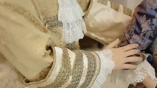 A noble man courting a woman. 18th century aristocrats clothes. Taking her hand.
