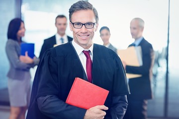 Portrait of lawyer holding law book