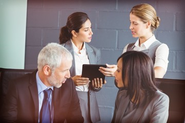 Business people interacting in conference room