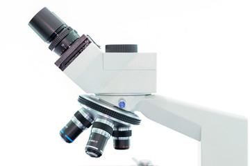 laboratory microscope with stereo eyepiece isolated on a white background