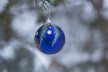 Christmas decorations hang on the Christmas tree