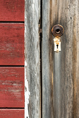 Broken door handle and old lock on ghost town in Kennicott, Alas