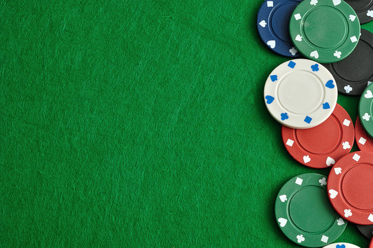 Poker chips forming a border with a green background