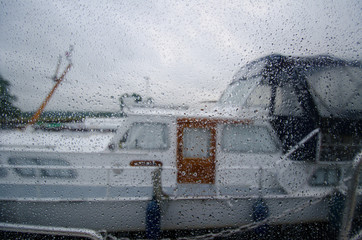 The view from the window with raindrops on the Houseboat