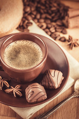 Cup fragrant hot coffee with bean chocolate