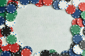 Poker chips forming a border with a white background
