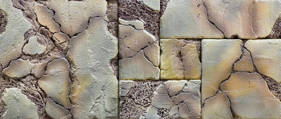 a wall of rough weathered decorative stones