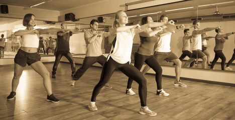 Men and ladies dancing zumba