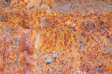 A background of peeling paint and rusty old metal