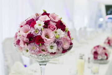 close up photo of bouquet on wedding served table