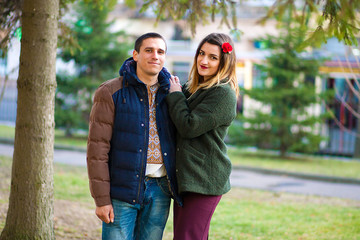 Fototapeta premium A young boy and girl hugging in the park