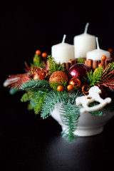 Winter table centerpiece wreath with candles, new year toys