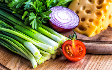 Different raw vegetables background.Cheese.