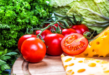 Different raw vegetables background.Cheese.