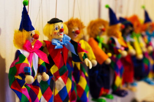 marionettes clowns lined up rich colors