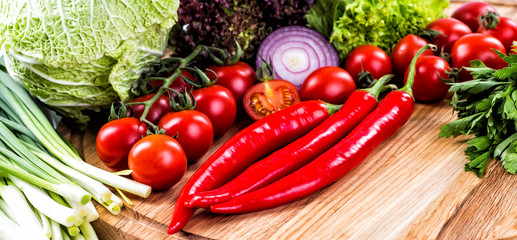 Different raw vegetables background.Cheese.