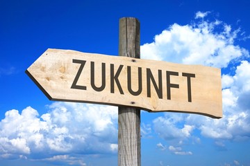 Zukunft - Future in German - wooden signpost